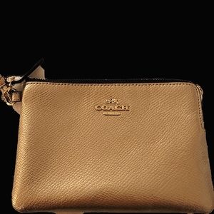 Coach wristlet. Gold, never used, authentic.